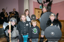 Guizer Jarl Lyle Tulloch presents a shield to Lisa Johnson, Teacher at Bressay Primary School with school pupils Andrew Lowe (P2), Abby Gifford (P5) Dean Gifford (P1) and Brandon Lowe (P7), - Bressay Hall - Bressay Up Helly-Aa 28 February 2014