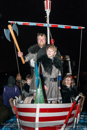 Guizer Jarl Lyle Tulloch with Brandon Lowe and the other Juniors in the Galley Nordis - the Procession Bressay Up Helly-Aa 28 February 2014