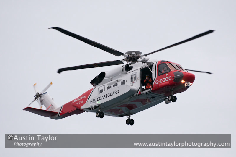 Up Helly-Aa 2011: morning procession - the Coastguard helicopter surveys the scene at Alexandra Wharf