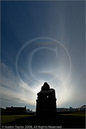 22 degree halo around the Sun along with an upper tangent arc, supralateral arc and circumzenithal arc around and above Scalloway Castle, Shetland