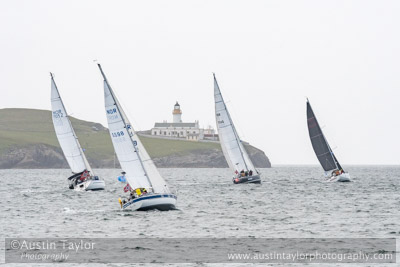 Yachts Pass Bressay Lighthouse, leaving Lerwick on the return leg of the 20204 Bergen Shetland Race